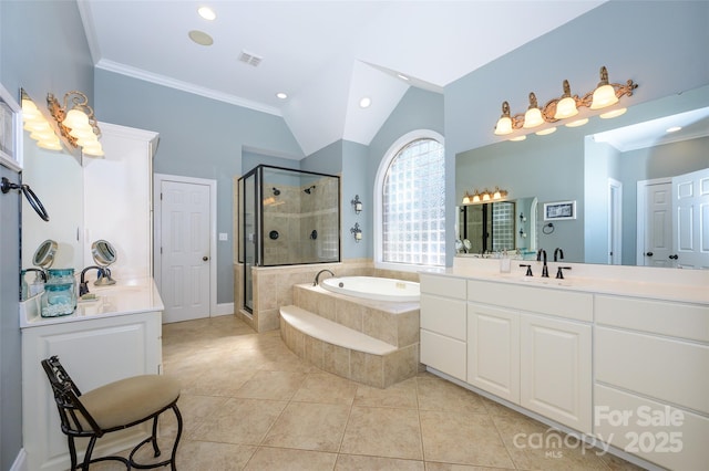 bathroom featuring a sink, visible vents, vaulted ceiling, a shower stall, and tile patterned floors