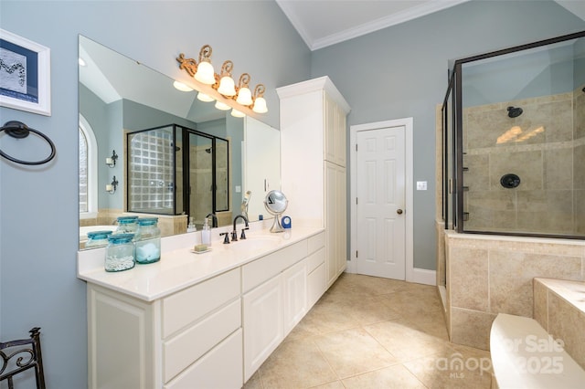 full bathroom featuring a stall shower, tile patterned flooring, crown molding, and vanity