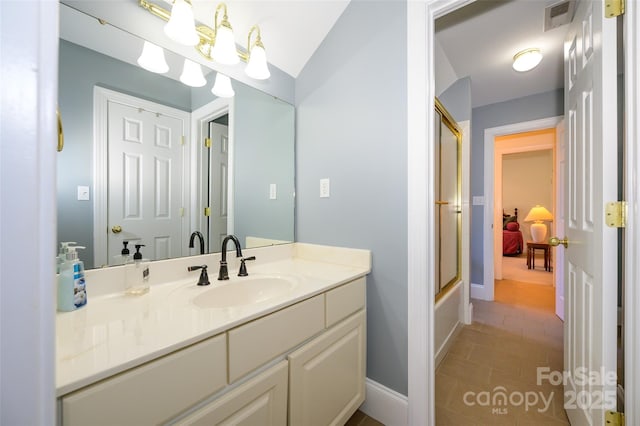 bathroom with tile patterned flooring, bath / shower combo with glass door, vanity, visible vents, and baseboards