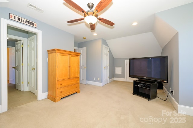 interior space featuring light carpet, lofted ceiling, visible vents, and recessed lighting