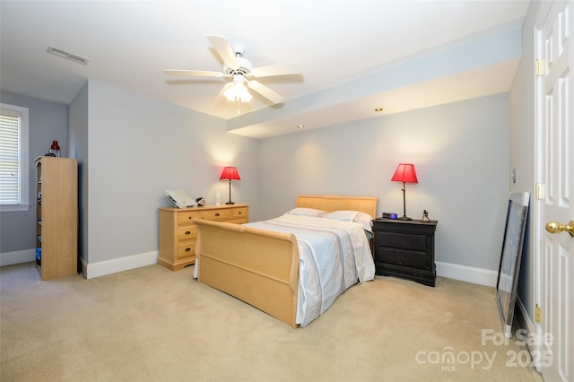 bedroom featuring light colored carpet, visible vents, ceiling fan, and baseboards