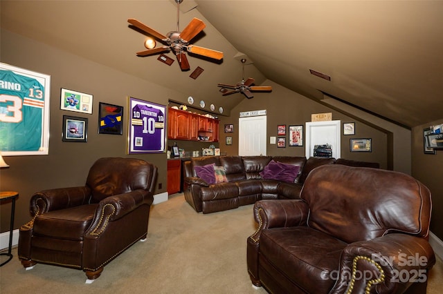 living room with lofted ceiling, ceiling fan, and light colored carpet