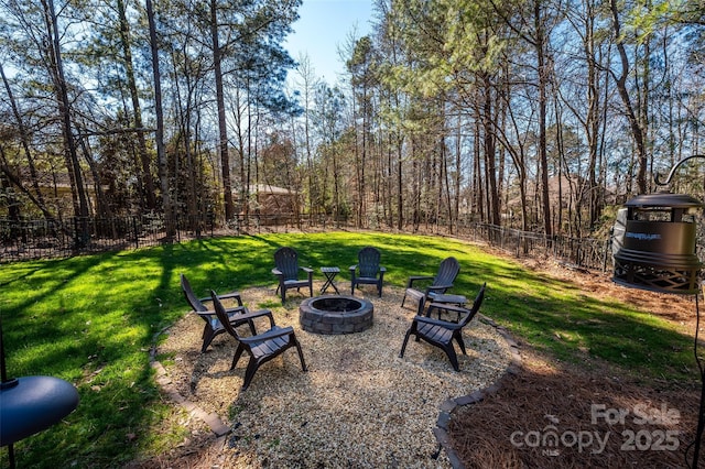 view of yard with an outdoor fire pit and a fenced backyard