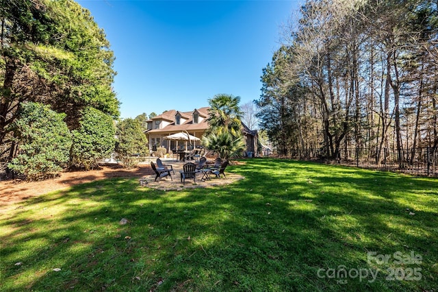 view of yard with a patio and fence