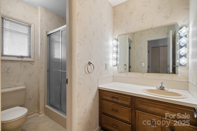 bathroom featuring a stall shower, toilet, and wallpapered walls