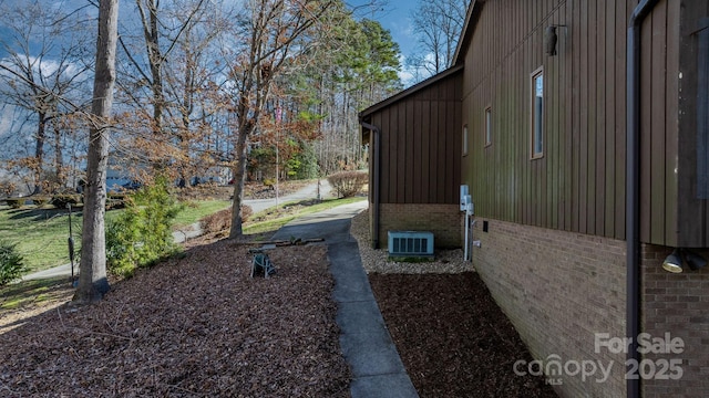 view of home's exterior with brick siding