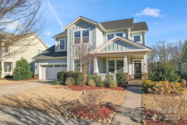 craftsman inspired home with driveway, an attached garage, board and batten siding, and brick siding