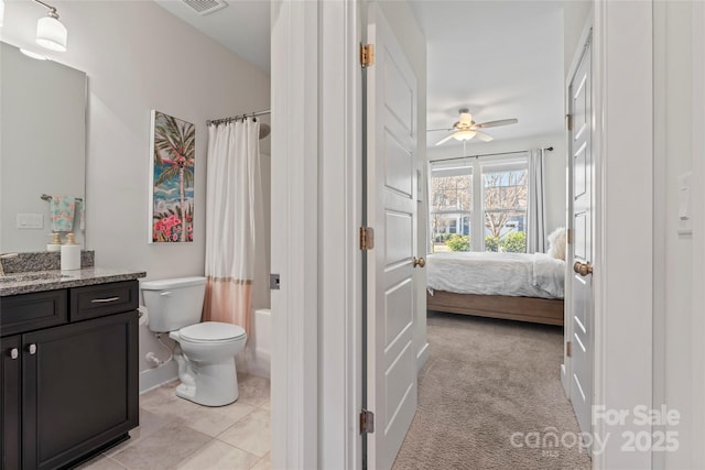 bathroom featuring visible vents, toilet, shower / bath combo with shower curtain, ensuite bathroom, and vanity