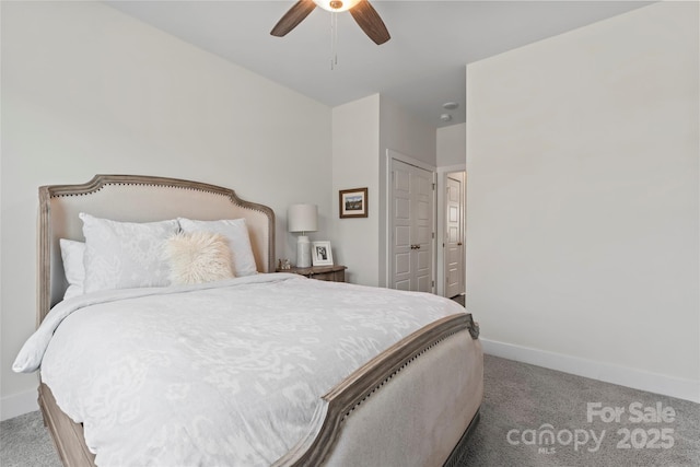 carpeted bedroom with a ceiling fan and baseboards