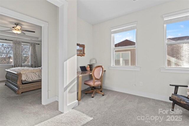 office with light colored carpet, ceiling fan, and baseboards