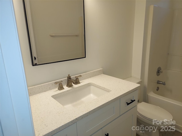 full bathroom featuring tub / shower combination, toilet, and vanity