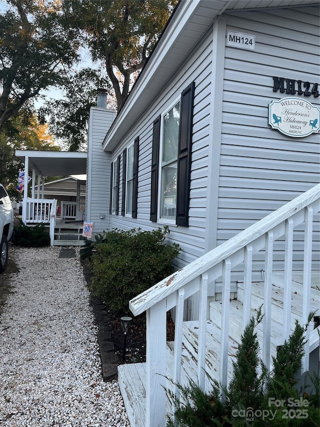 view of property exterior with a porch