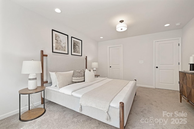 bedroom featuring baseboards, recessed lighting, and light colored carpet