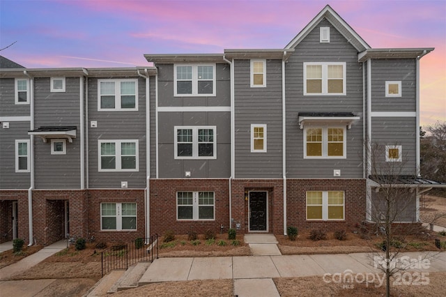 multi unit property with brick siding