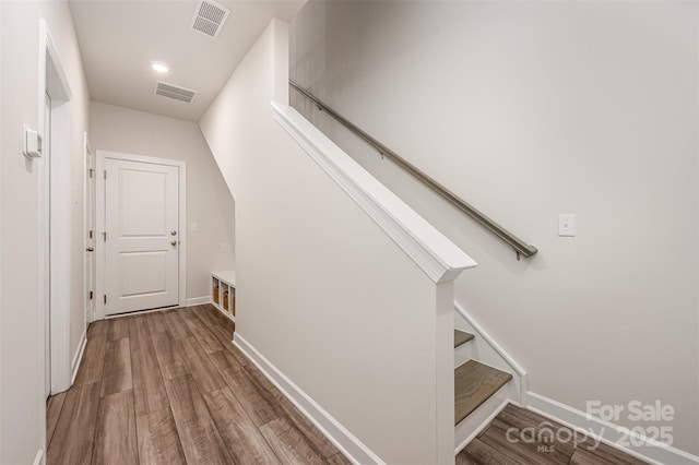 interior space with visible vents, recessed lighting, baseboards, and wood finished floors