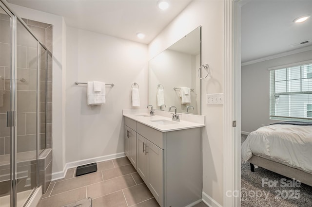 bathroom featuring double vanity, recessed lighting, a shower stall, and a sink