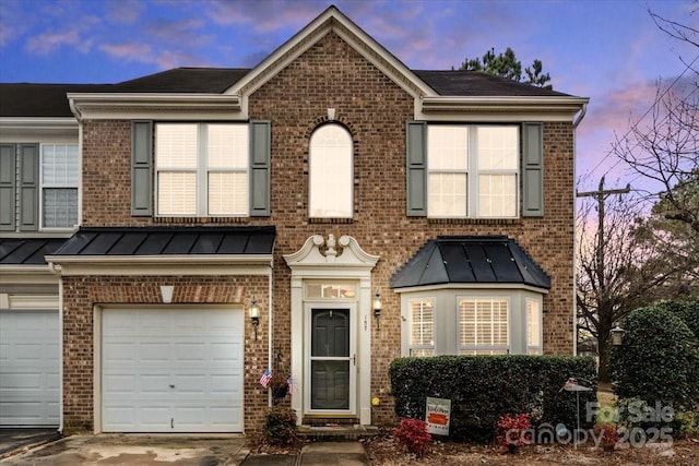 view of front of home with a garage