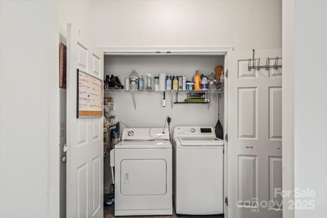 clothes washing area featuring independent washer and dryer