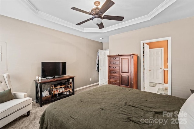 bedroom featuring ensuite bathroom, ceiling fan, a raised ceiling, light carpet, and ornamental molding