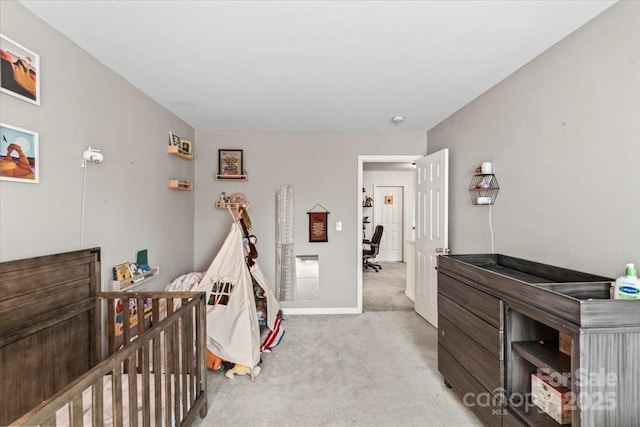 bedroom featuring light colored carpet