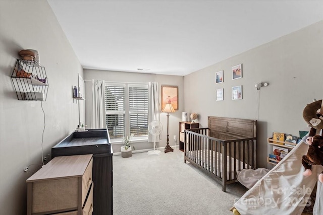 bedroom featuring light colored carpet