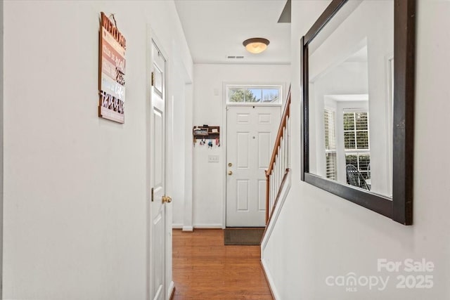 doorway to outside featuring hardwood / wood-style flooring