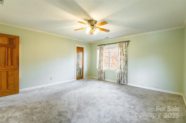 empty room featuring ornamental molding and light carpet