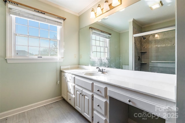 bathroom featuring toilet, a shower with door, vanity, and crown molding