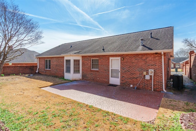 back of house featuring central AC unit and a patio