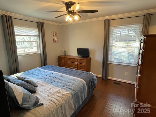 bedroom featuring ceiling fan, crown molding, and dark hardwood / wood-style flooring