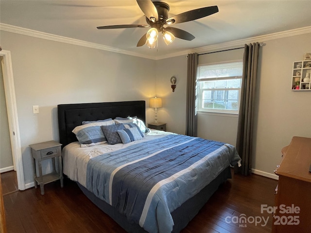 bedroom with ceiling fan, ornamental molding, and dark hardwood / wood-style flooring