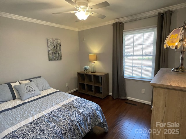 bedroom with ceiling fan, crown molding, and dark wood-type flooring