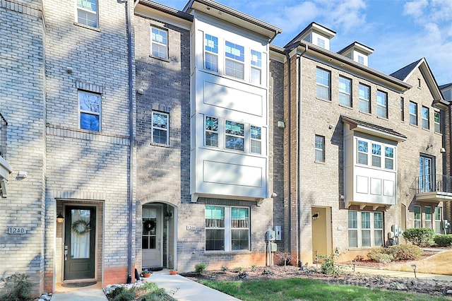 multi unit property featuring brick siding