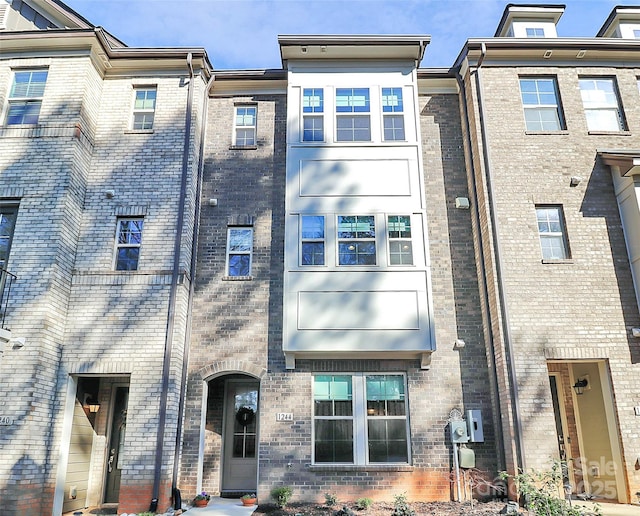 view of front of house with brick siding