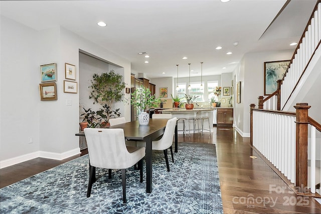 dining area featuring baseboards, dark wood-type flooring, and recessed lighting