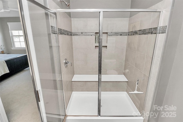 bathroom featuring a stall shower and ensuite bath