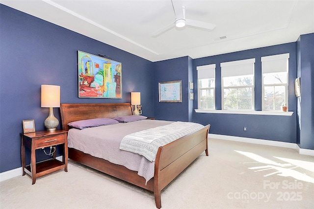 bedroom featuring baseboards, visible vents, and light colored carpet