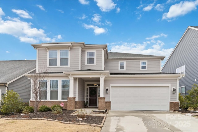 view of front of home featuring concrete driveway, brick siding, and an attached garage