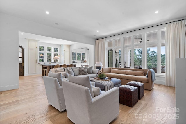 living area featuring recessed lighting and light wood-style floors