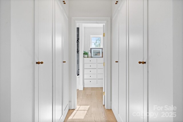 hall with light wood-style flooring