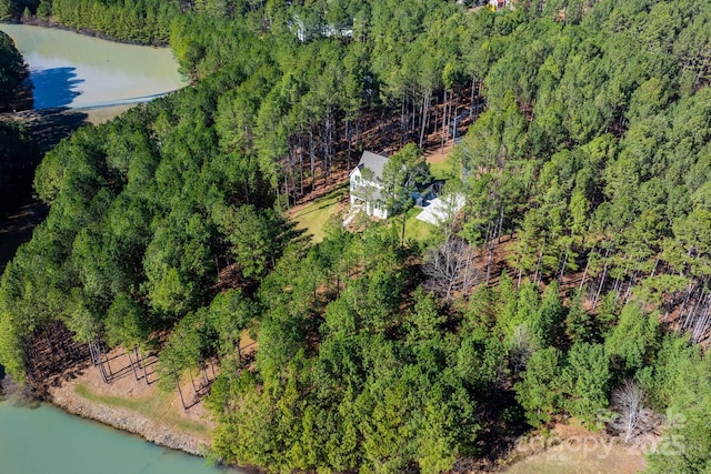 bird's eye view with a forest view and a water view