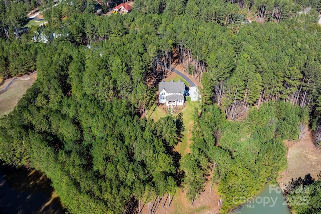 bird's eye view featuring a forest view