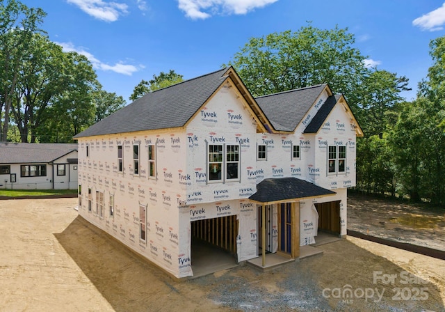 view of front of house with a shingled roof