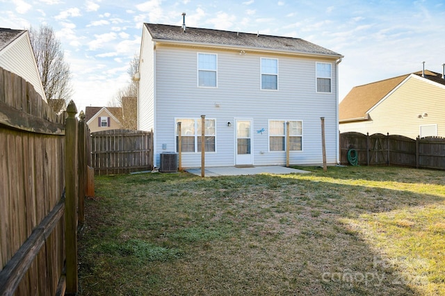 rear view of house featuring a patio, a lawn, and central air condition unit