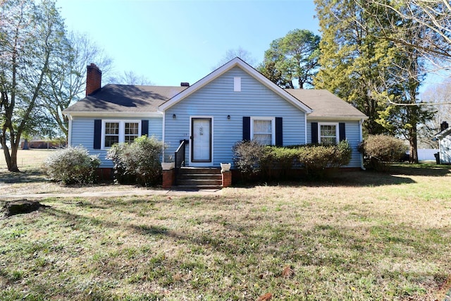 view of front of home with a front yard