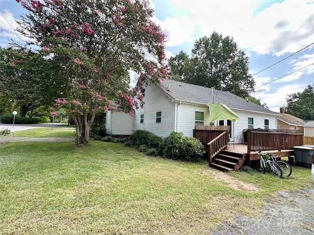 exterior space featuring a yard and a deck