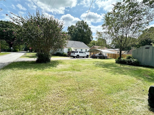 view of yard featuring a carport