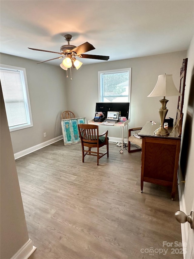 home office with ceiling fan and wood-type flooring