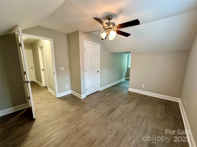 additional living space featuring hardwood / wood-style flooring, ceiling fan, and vaulted ceiling