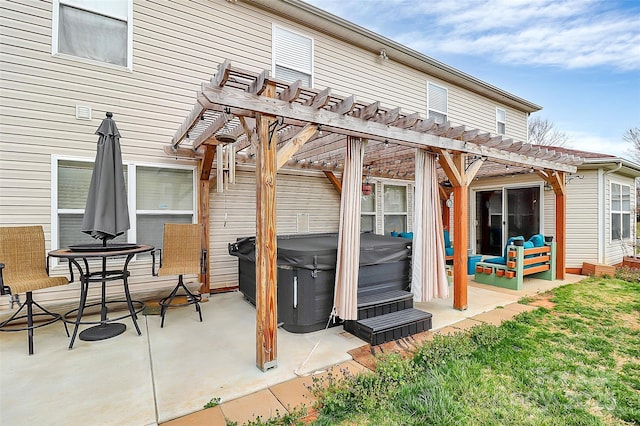 view of patio with a hot tub and a pergola